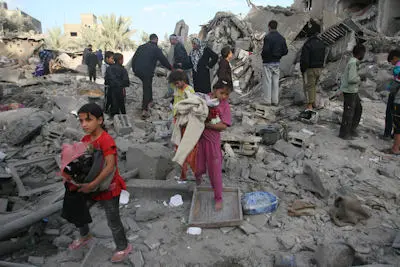 On 18 November, girls salvage belongings from the rubble of their home, in the Shabbora refugee camp, near the city of Rafah, in the southern Gaza Strip. Behind them, others observe the wreckage in the area, which was destroyed during an Israeli airstrike.By 18 November 2012 in Occupied Palestinian Territory, hostilities between the Gaza Strip and Israel have resulted in the killings of 53 Palestinians and three Israelis. The conflict escalated following rocket attacks from Gaza into Israel and retaliatory air strikes from Israel into Gaza that are continuing. Palestinian casualties include 10 children and five women; another child was killed by rockets misfired by Palestinian militants. Over 520 Palestinians &ndash; mostly civilians, including at least 140 children and 83 women &ndash; have been injured, together with 50 Israelis. Damage to homes has forced many families in Gaza and southern Israel to move to safer zones. Due to nightly air strikes into Gaza, dozens of schools have been damaged, and hospitals have exceeded capacity. The escalating violence is also having a substantial psychological effect, especially on children. UNICEF and partners are supporting emergency efforts for Gazans in the areas of health and nutrition, water, sanitation and hygiene, education and child protection, including psychosocial assistance. UNICEF requires US$2.97 million to fund these responses.