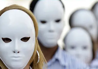 Demonstrators wear white masks during a symbolic protest in downtown Rio de Janeiro May 11, 2009. Rio de Paz (Peace Rio) NGO placed 17,000 stones on the ground to represent the victims of violence killed during the past 28 months in the state of Rio, organizers said. REUTERS/Sergio Moraes (BRAZIL CRIME LAW CONFLICT IMAGES OF THE DAY)